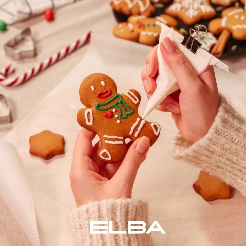 Best Christmas gift ideas with a woman joyfully designing festive cookies at home celebrating creativity warmth family traditions.