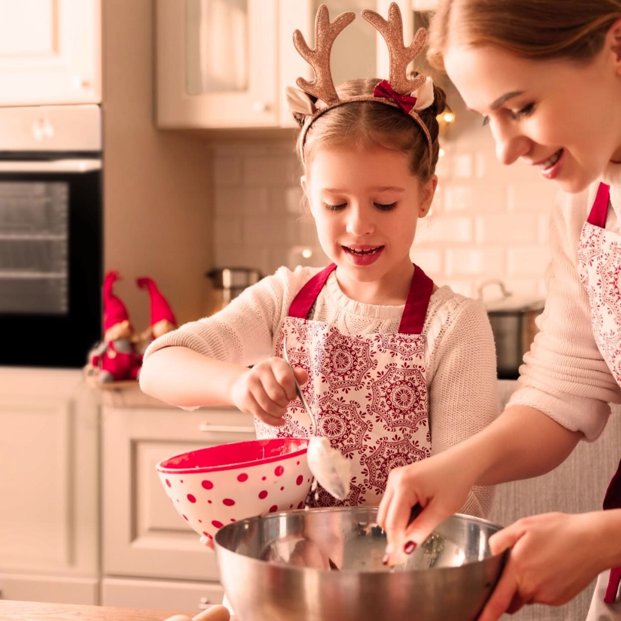 Best Christmas gift ideas with a mother and her daughter baking together for holiday season using the gifts they received.