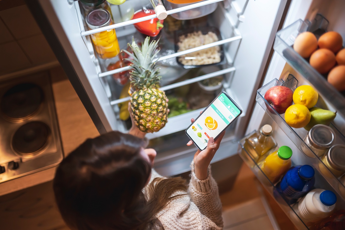 An open smart fridge full of vegetables, fruits, and other foods, by MVP Appliances