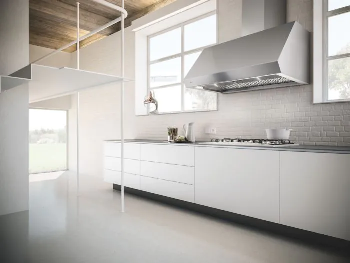 Modern kitchen with a minimalistic design. Features sleek white cabinets, a stainless steel range hood, and large windows, creating a bright, airy feel.