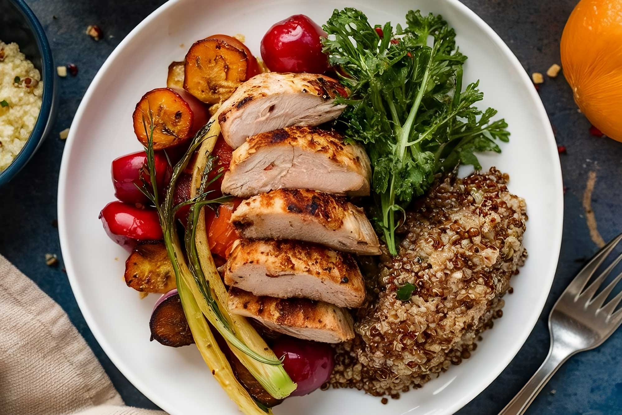 Healthy oven-baked chicken with vegetables and quinoa, prepared with Elba Oven