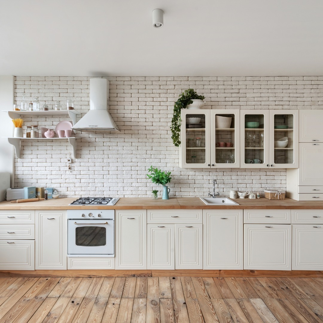 Baking cookies with kids in a cozy kitchen using MVP ovens, featuring a clean white cabinet setup and wooden countertops.