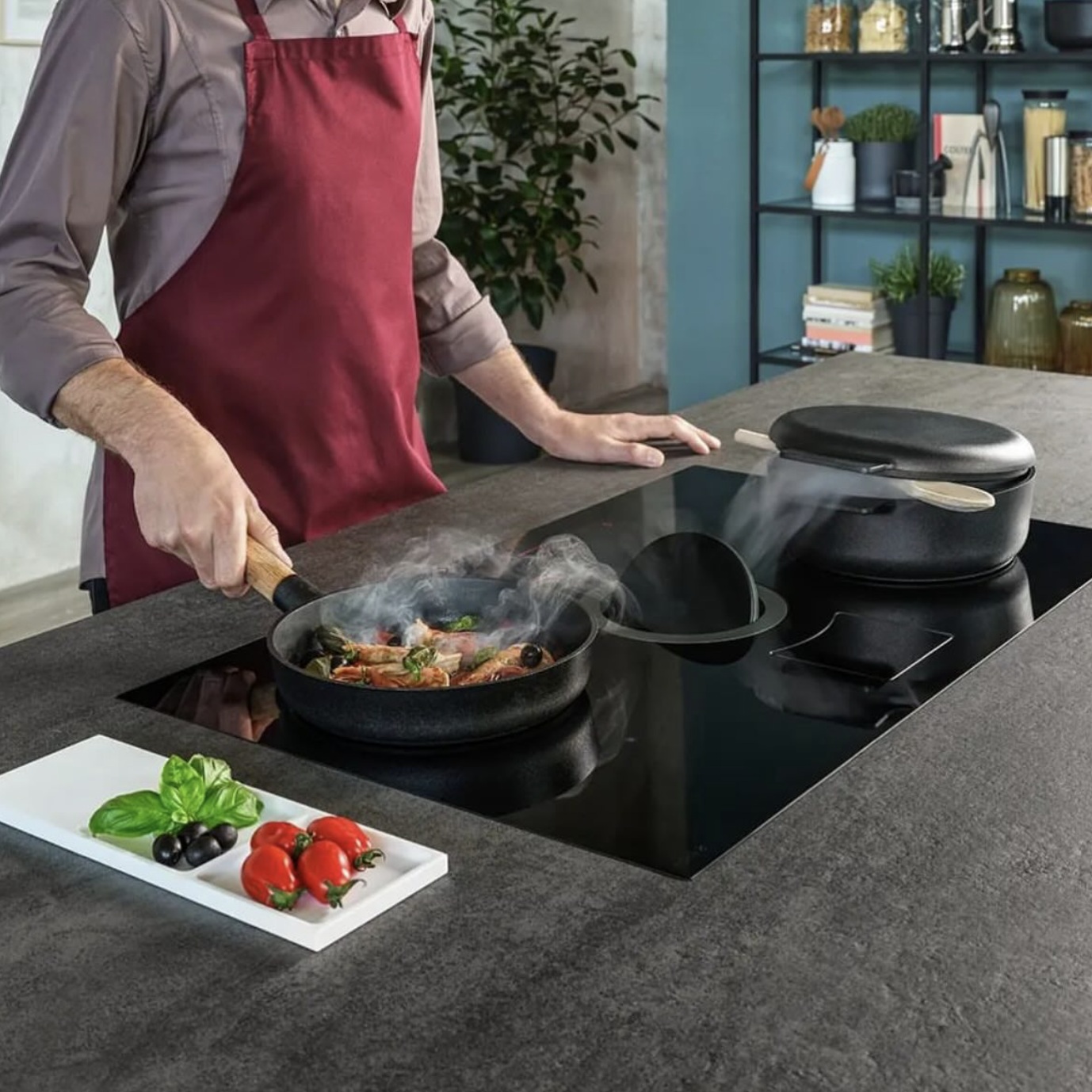 Man cooking on a modern stovetop using kitchen tools for lunch ideas for two