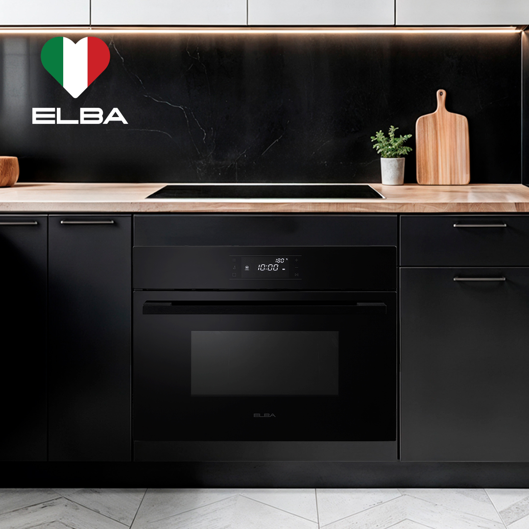 Sleek kitchen with black microwave oven, wood countertop, and cutting board. Minimalist vibe, modern oven at center. ELBA logo with Italian flag colors.